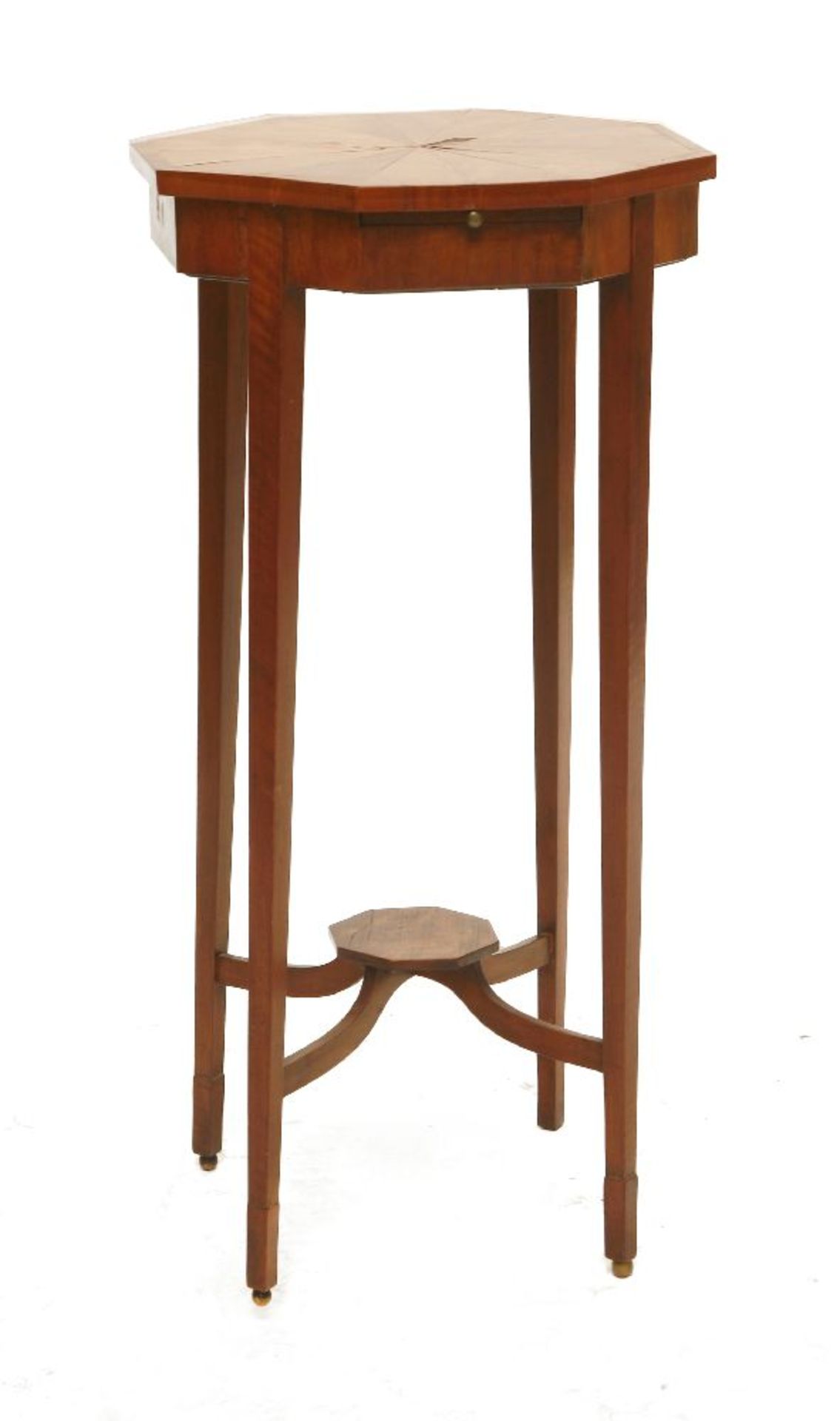 An Edwardian satinwood occasional table,the segmented, crossbanded, octagonal top above a candle