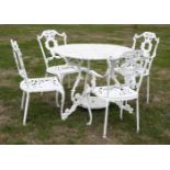 A painted metal garden table and four chairs,the circular table with pierced decoration, scrolled
