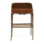 An Edwardian strung and inlaid tray table,with a three-quarter gallery, over a frieze drawer and