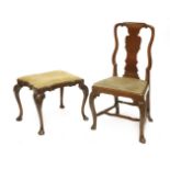 A George II style walnut single chair,with a shaped back, on carved cabriole front legs, anda