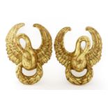 A pair of carved giltwood wall brackets,20th century, in the form of swans,41cm high (2)