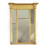 A Regency gilt gesso overmantel mirror,with a concave ball-mounted cornice over a lattice frieze and