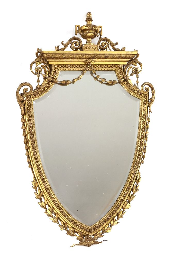 A Victorian giltwood and gesso heart-shaped wall mirror,surmounted by an urn and scrolls over