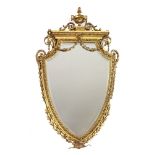 A Victorian giltwood and gesso heart-shaped wall mirror,surmounted by an urn and scrolls over