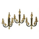 Three George III-style two-branch wall lights, gilt bronze and black painted,36cm high (3)