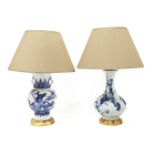 Two Chinese blue and white vase/table lamps,20th century, each mounted on a turned giltwood case and