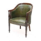 A Regency mahogany library chair,upholstered in green leather, the show wood frame on turned, reeded