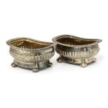 A near pair of George III silver salts,by two different makers, London 1818/19, of oblong shape with