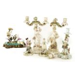 A German porcelain group,late 19th century, depicting an 18th century couple milking a goat,18.5cm