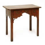 A George III oak side table, the crossbanded top over three drawers and chamfered square legs,81cm