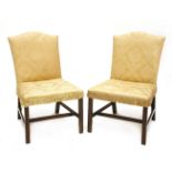 A pair of George III mahogany side chairs,upholstered in gold damask, on chamfered square