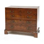 A George III chequer strung mahogany chest of drawers,having a brushing slide over four long
