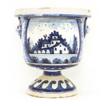 A tin-glazed blue and white pottery urn,probably North European, 19th century, in the form of a