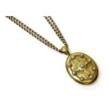 A Victorian gold split pearl oval hinge locket, with an applied raised Latin cross to the front