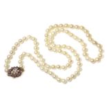 A single row cultured pearl necklace,with a cultured pearl and amethyst cluster clasp. A single