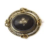 A Victorian gold, split pearl and banded agate memorial brooch,a large oval banded agate cabochon