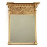 A giltwood and gesso pier mirror,the ball cornice over a ribbon-tied swag frieze and cluster