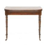 A George III strung mahogany fold-over tea table, the 'D' shaped top, on ring turned tapering legs,