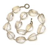 A single row freeform faceted rock crystal necklace, strung knotted to a silver T-bar and hoop