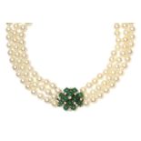 A three row graduated cultured pearl necklace,with an emerald and diamond set cluster clasp. Three