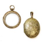 A Victorian gold oval hinged locket, engraved with ivy leaves to the front cover, to the reverse a