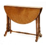 A Victorian bird's-eye maple Sutherland table, the oval drop-leaf top on fret cut ends and turned