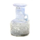 A Roman blue glass handled jug, 3rd century, 11cm high