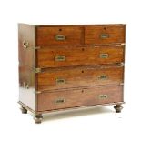 A 19th century teak military chest, in two parts, fitted two short above three long drawers, each