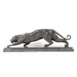 A contemporary bronze of a stalking leopard on a marble base, 65cm long