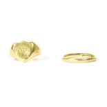 An 18ct gold wedding ring, Birmingham 1925, size O, 2.87g, and a gentlemen's gold shield shaped