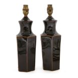 A pottery baluster vase table lamp, on a wooden stand, drilled, 47cm high overall and a pair of