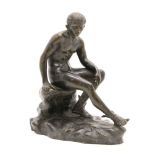 A late 19th to early 20th century Grand Tour bronze figure, depicting Hermes seated atop a rock,