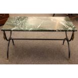 A green marble topped low table, the rectangular top on wrought iron base, 87cm wide, 46cm deep,