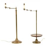 Two brass floor lights with adjustable arms, 104 and 117cm high