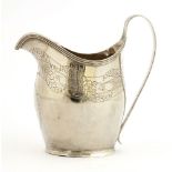 A George III silver milk jug, London 1804, probably by Peter, Anne & William Bateman,of oval bellied