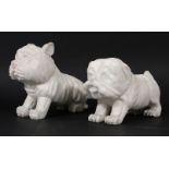 A pair of Art Deco carved marble dogs each approximately 20cm nose to tail