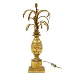 A gilt metal and wood pineapple form table lamp, 75cm high