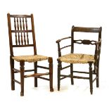 A 19th century Sussex type elbow chair, with rush seat on stretchered turned supports and a