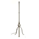 A wrought iron standard lamp on tripod supports, 135cm high