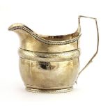 A George III silver cream jug, London 1802, by Daniel Pontifex, of conventional form with a