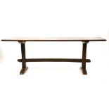 A 19th century teak campaign refectory table, the triple panel rectangular top on chamfered end
