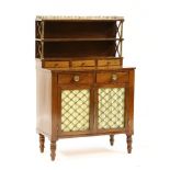 A Regency mahogany chiffonier with a raised back over five various drawers and grille inset doors,