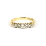 A graduated five stone diamond ring, marked 18ct, size M½, 3.05g