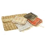 A collection of vintage saris, and woven Indian fabric shawlsProvenance: From the estate of the late