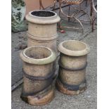 A pair of terracotta chimney pots and one larger (3)