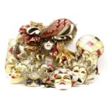 A collection of papier mache leather and ceramic theatrical masks, in the Venetian style, to include