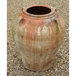 A treacle glazed terracotta jar, 65cm high