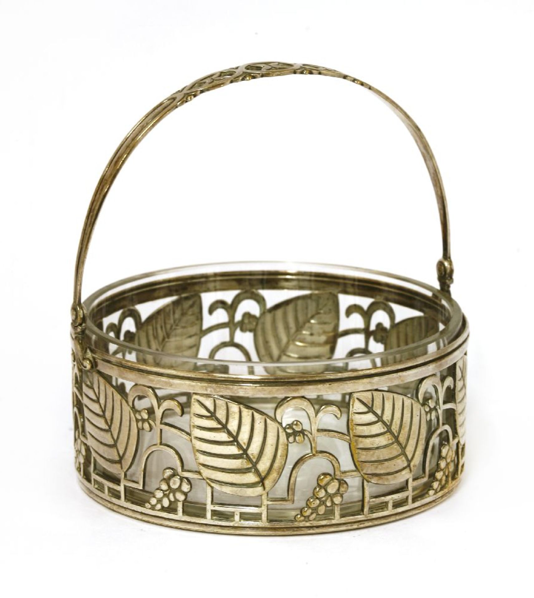 A WMF preserve basket,with pierced designs, a swing handle and a clear glass liner,14cm high