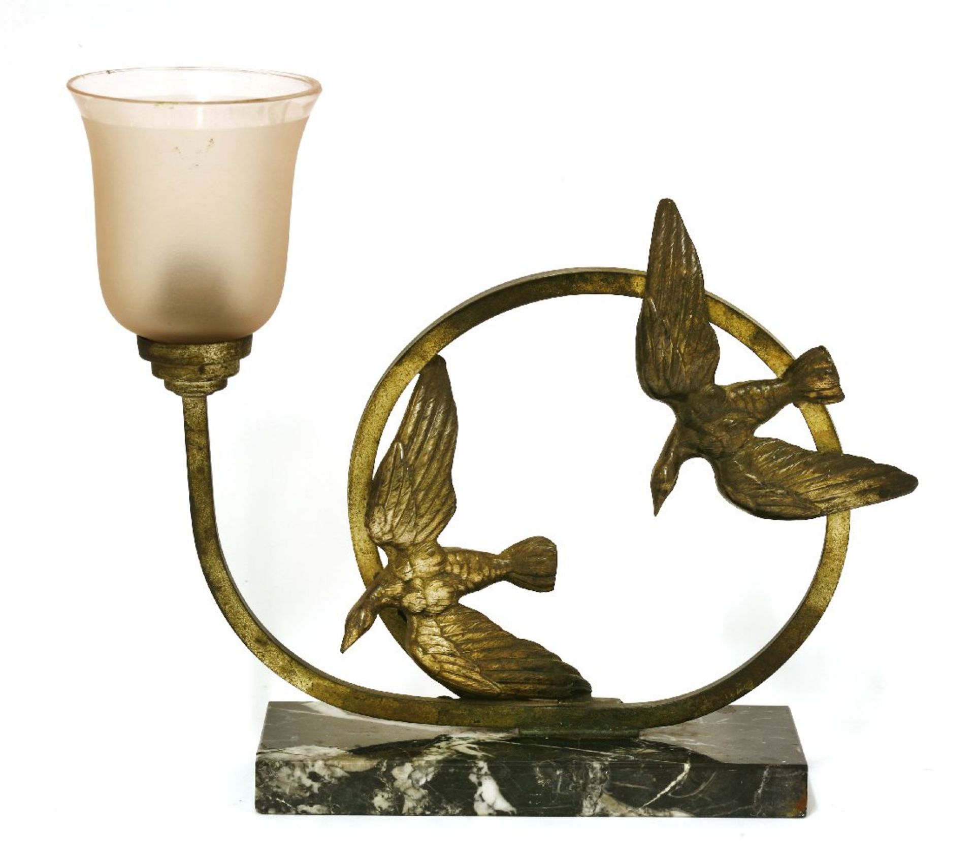 An Art Deco lamp base,mounted with two birds, with a frosted pink shade, on a marble plinth,24cm