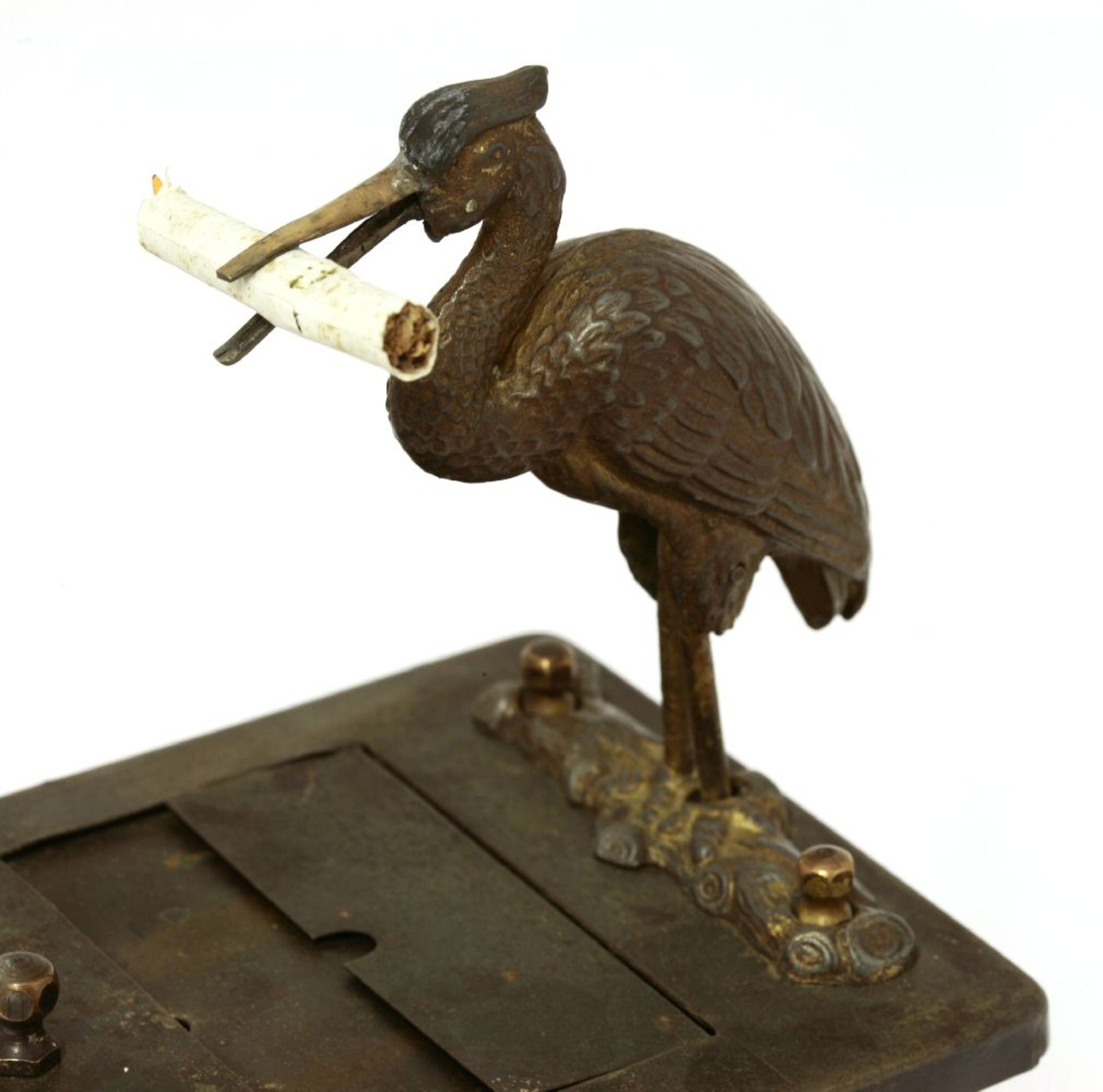 An Art Nouveau tinplate cigarette dispenser,mounted with a stork automata, the front panel mounted - Image 2 of 4